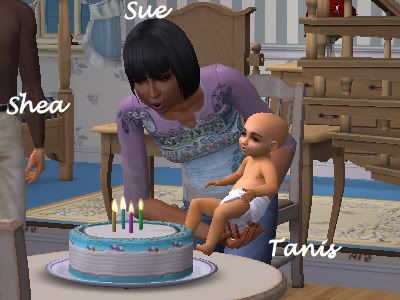 Sue blows out the candles for Tanis