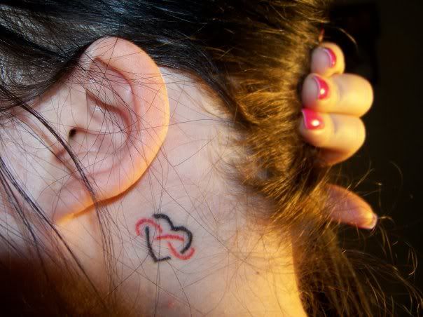Cross Tattoos Behind The Ear. Small Women Tattoos Behind